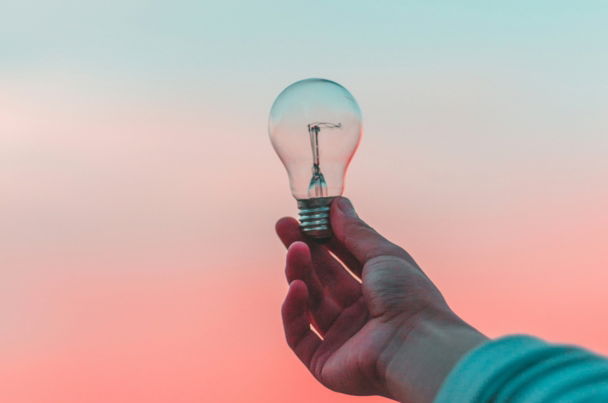 person holding light bulb